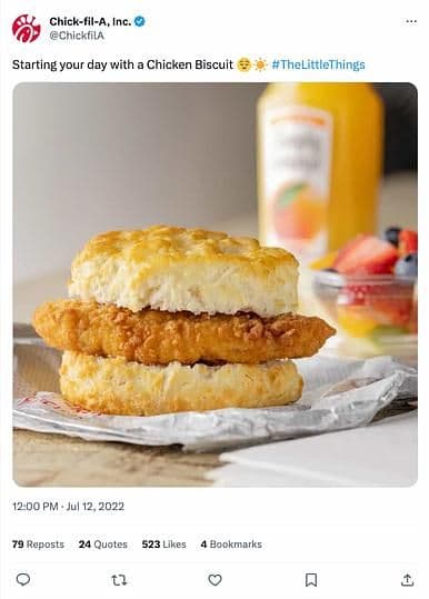 Image 16: A Chick-fil-A Post on X showing a chicken biscuit, fruit and orange juice. The caption reads, "Starting your day with a chicken biscuit #TheLittleThings."